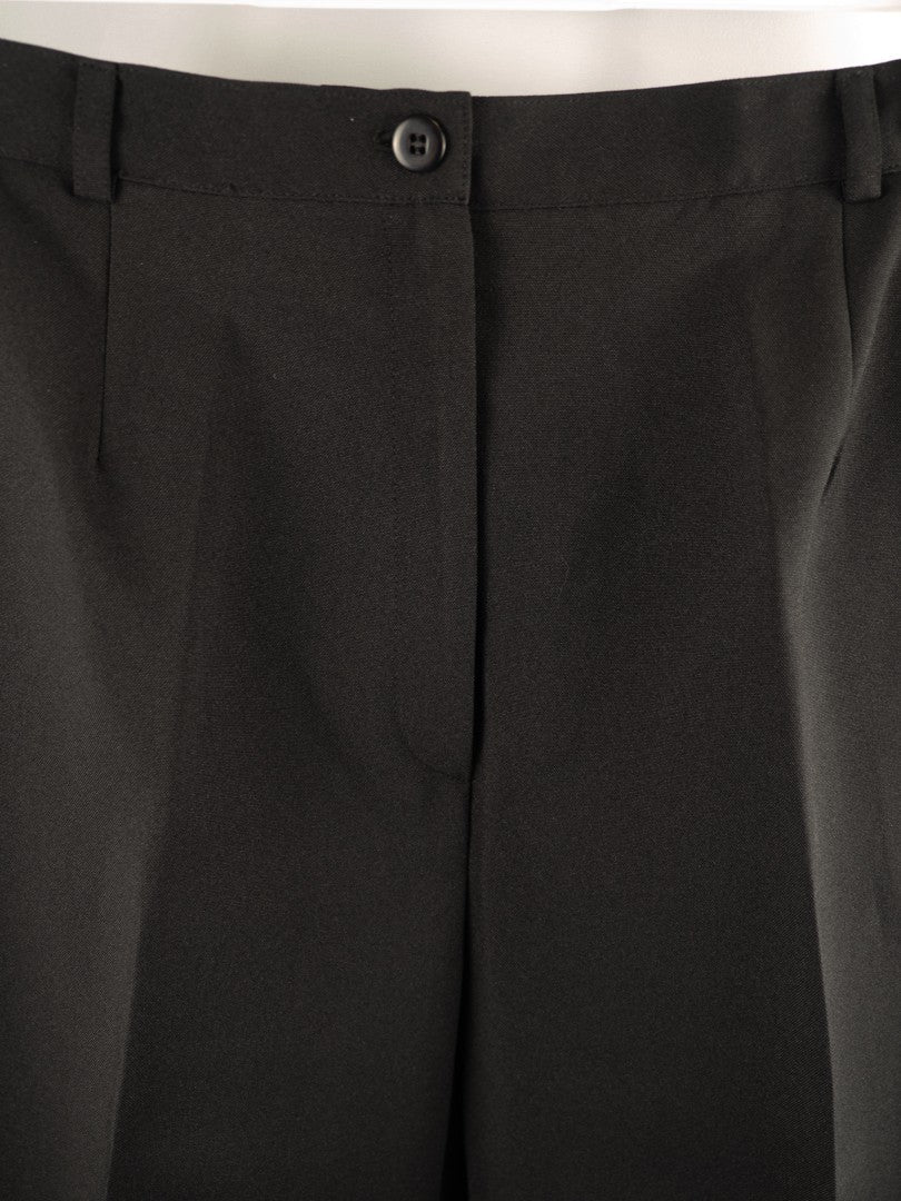 For Women black trousers size 16 with pull-up button closure and front pockets.