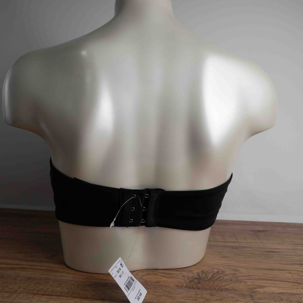 Next black strapless bandeau bra with scalloped hem and multiple hook back closure.