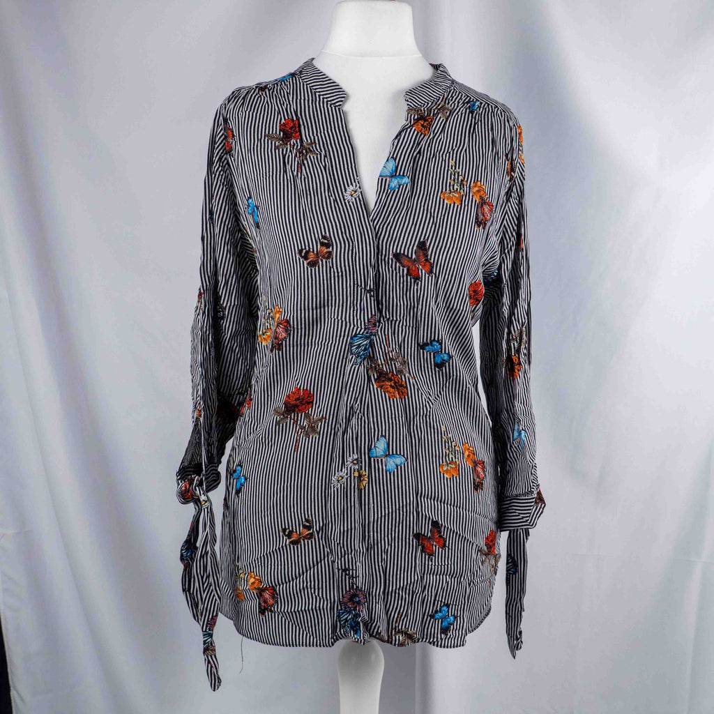 Dorothy Perkins black and white striped blouse with colourful butterfly print and tie cuffs.