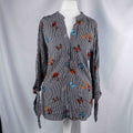 Dorothy Perkins black and white striped blouse with colourful butterfly print and tie cuffs.