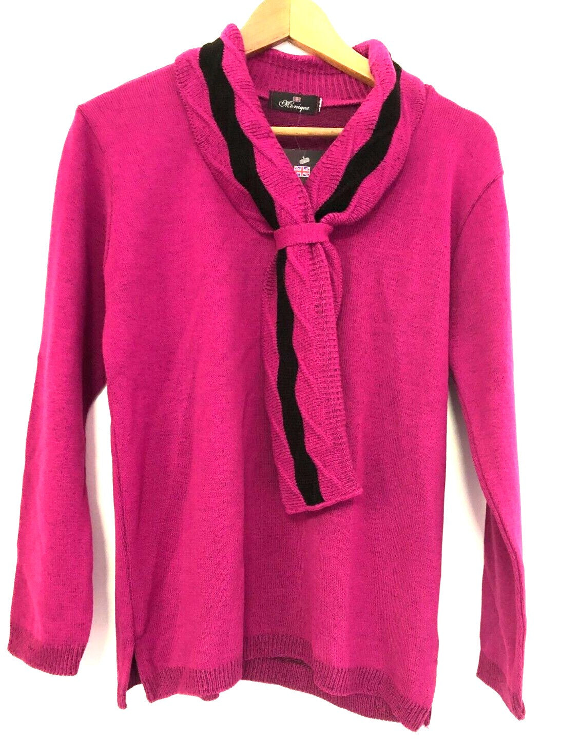 Monique pink crewneck sweater with mock scarf detail and toggle fastening.