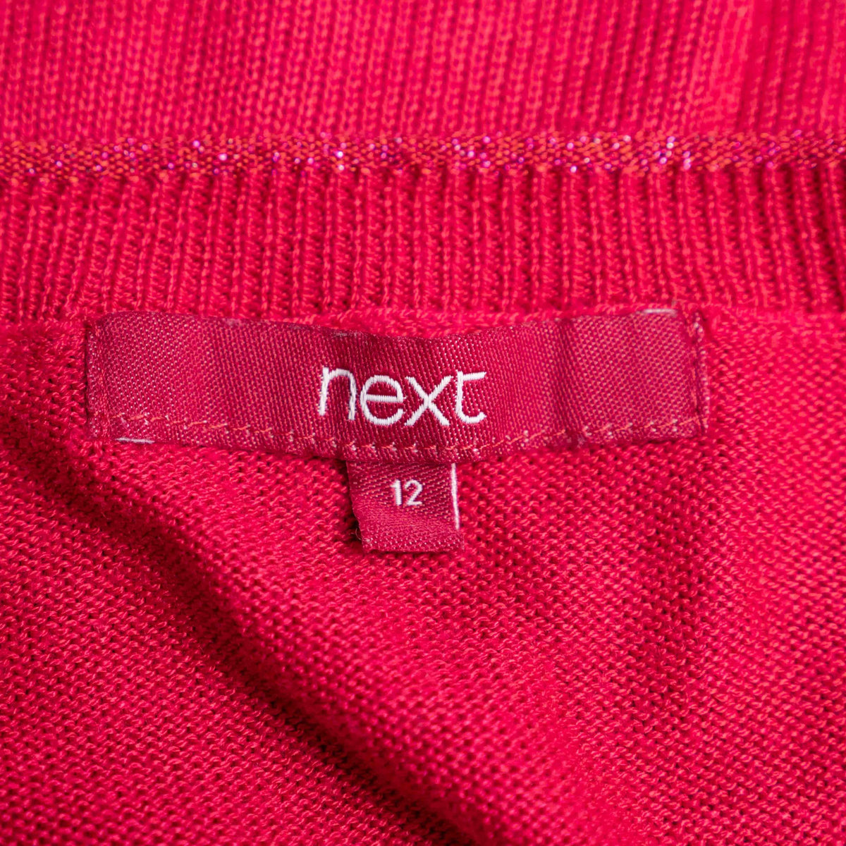 Next pink lightweight sweater with fine knit detailing on raglan sleeves and neckline.