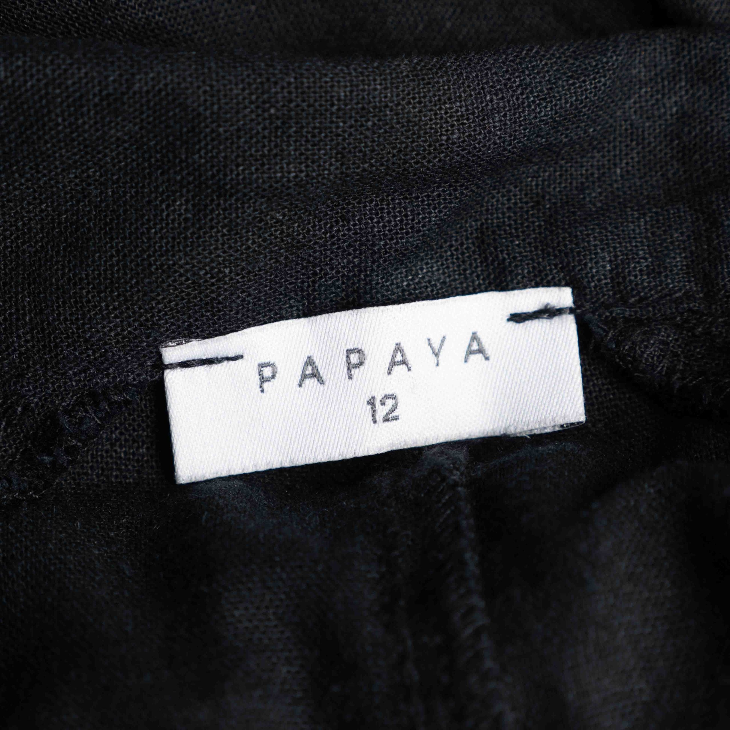 Papaya black shirt dress with button-down front, matching belt, and chest pockets.