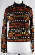 Zara black crewneck sweater with orange, yellow, and cream geometric pattern.