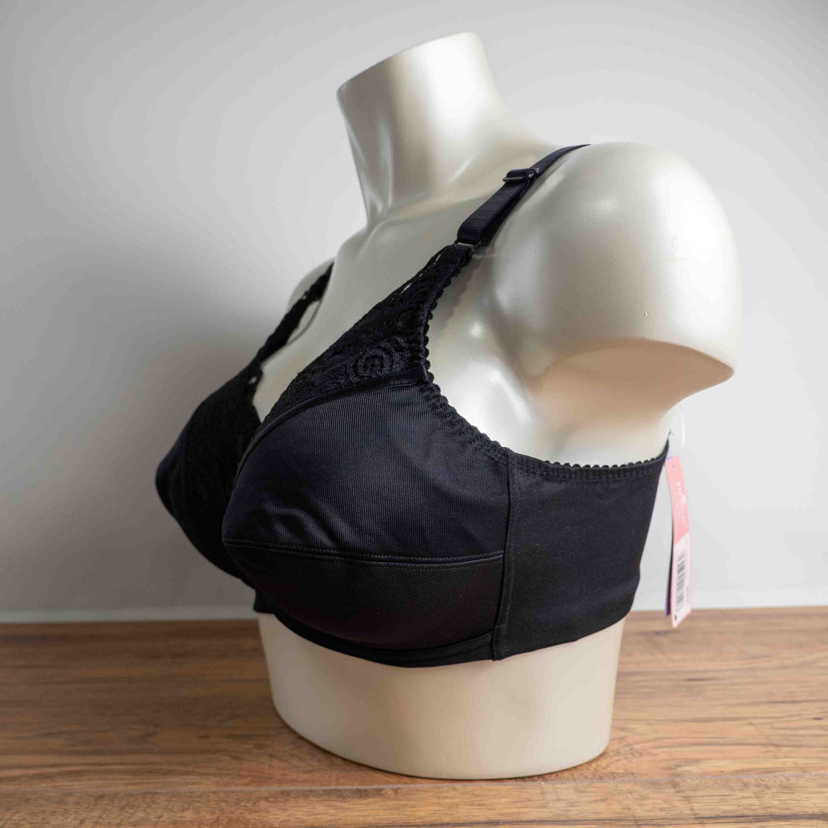Anonymous black lace bra with soft cups and adjustable straps, brand new with tags.