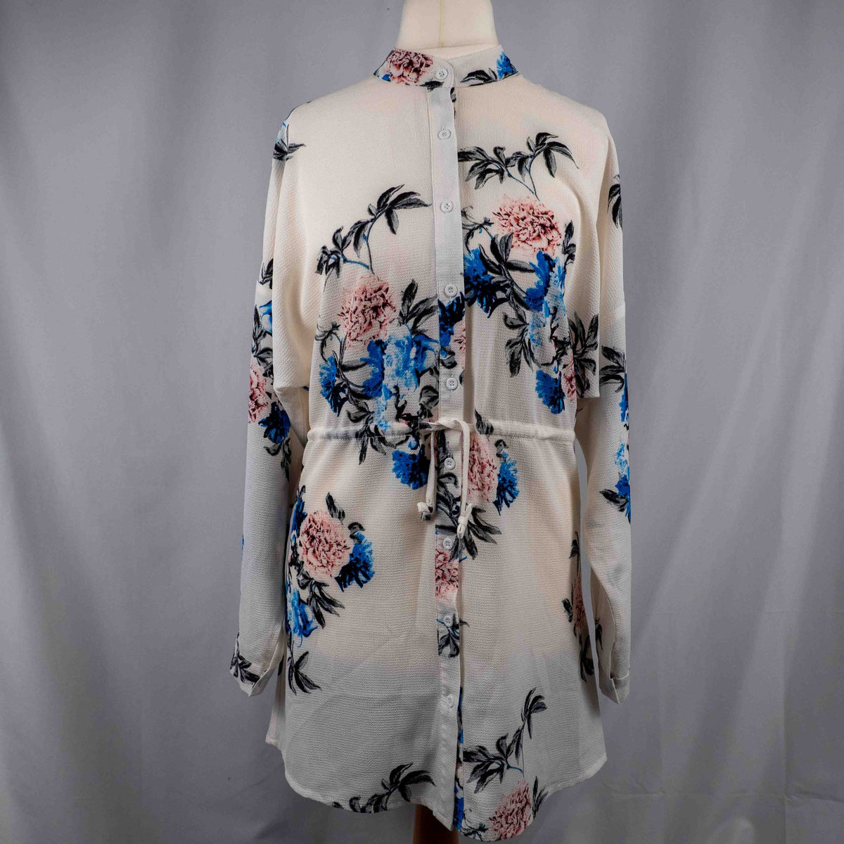 Boohoo white floral blouse with blue and pink prints, button front, drawstring waist.
