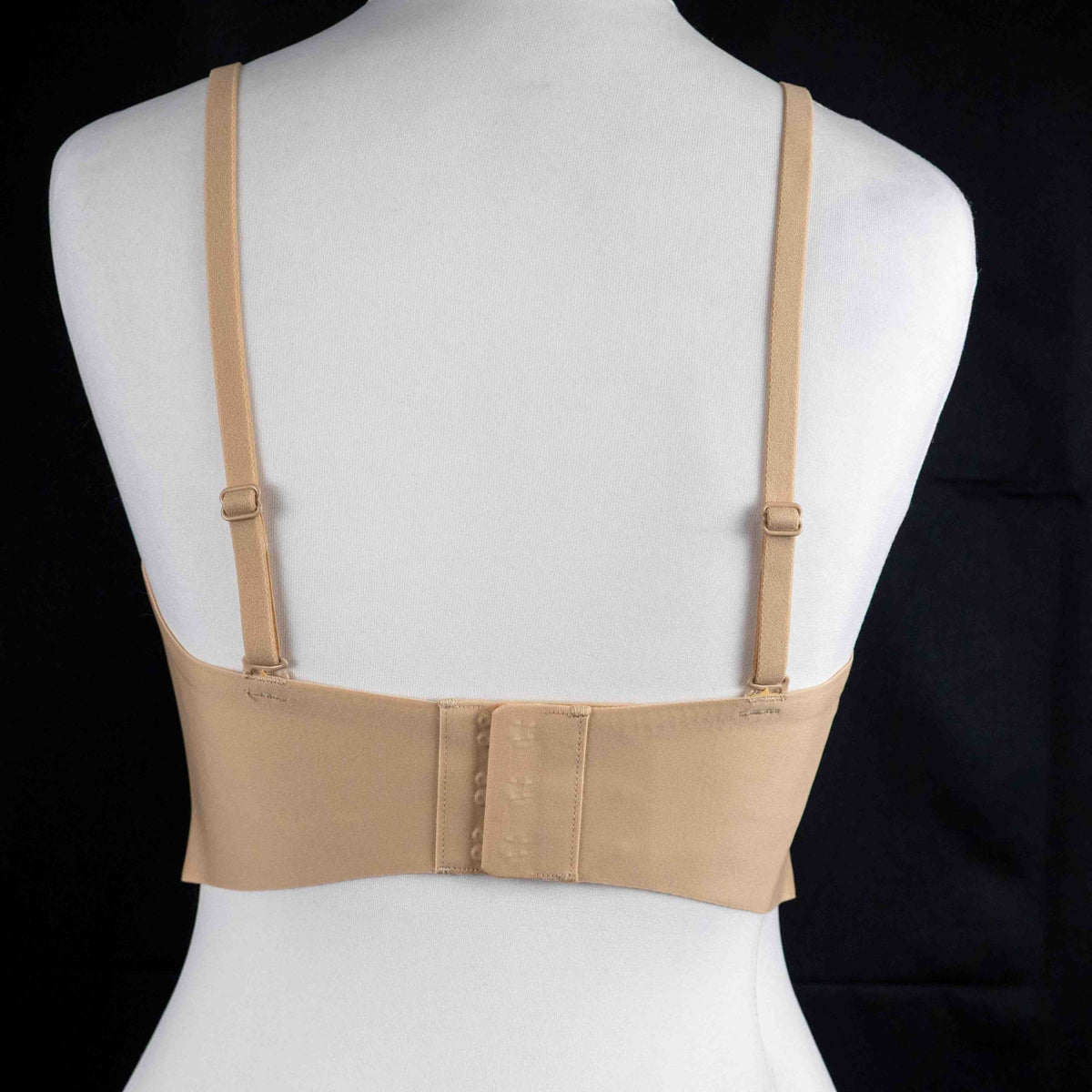 Celeste D'Or beige convertible strapless bra with adjustable straps and back hook closure.