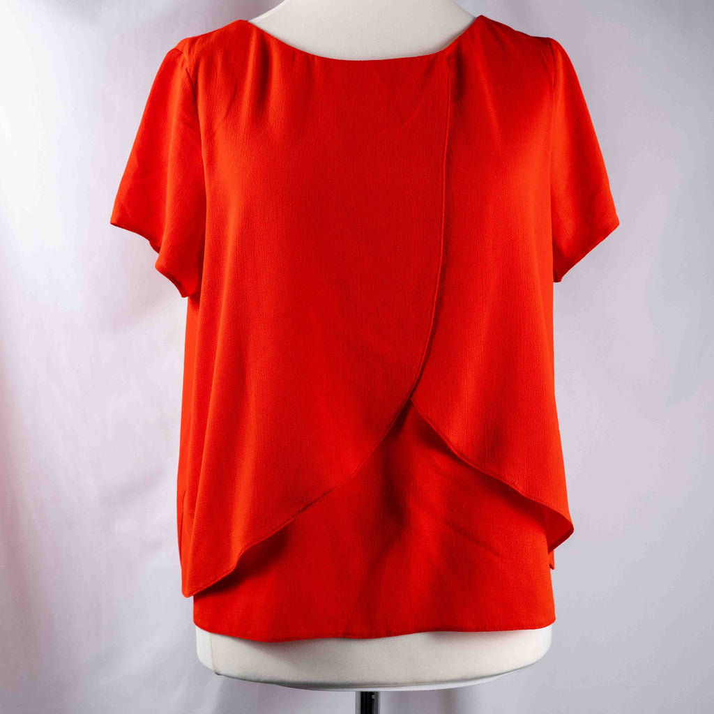 M&Co red layered blouse with short sleeves, made of polyester and elastane.