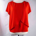 M&Co red layered blouse with short sleeves, made of polyester and elastane.