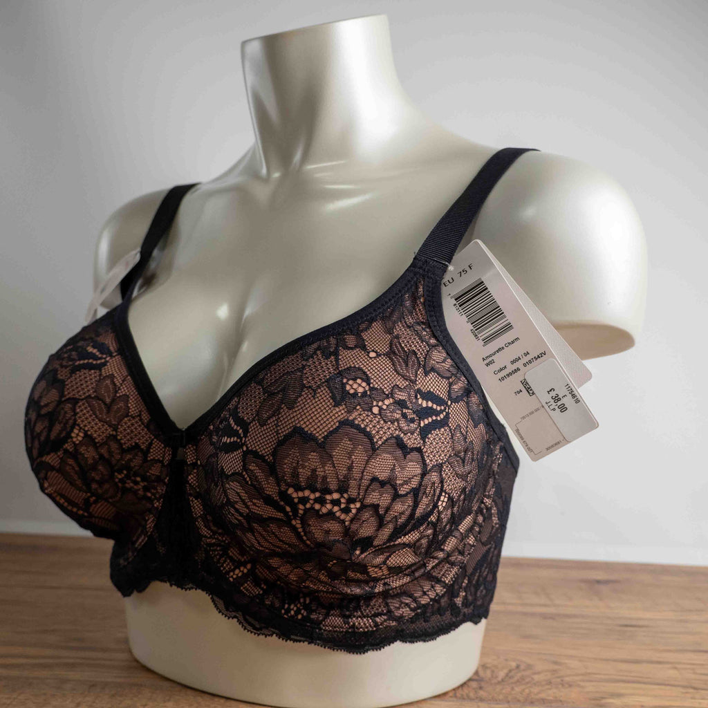 Triumph black lace bra with elegant overlay, underwired, adjustable straps, brand new with tags.