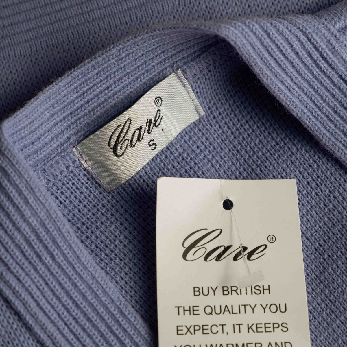 Care lilac cardigan with V-neck, five buttons, two pockets, ribbed trim.