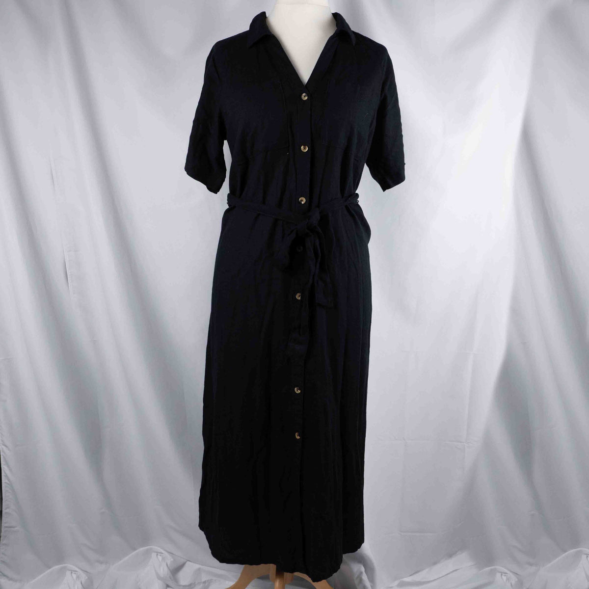 Papaya black shirt dress with button-down front, matching belt, and chest pockets.