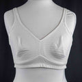 Nicola Jane white mastectomy bra with adjustable straps and back hook closure.