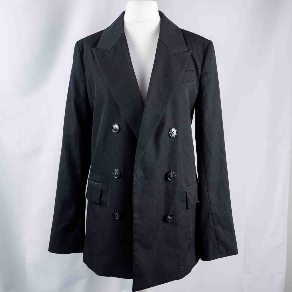 H&M black double-breasted blazer with structured lapel and six front buttons.