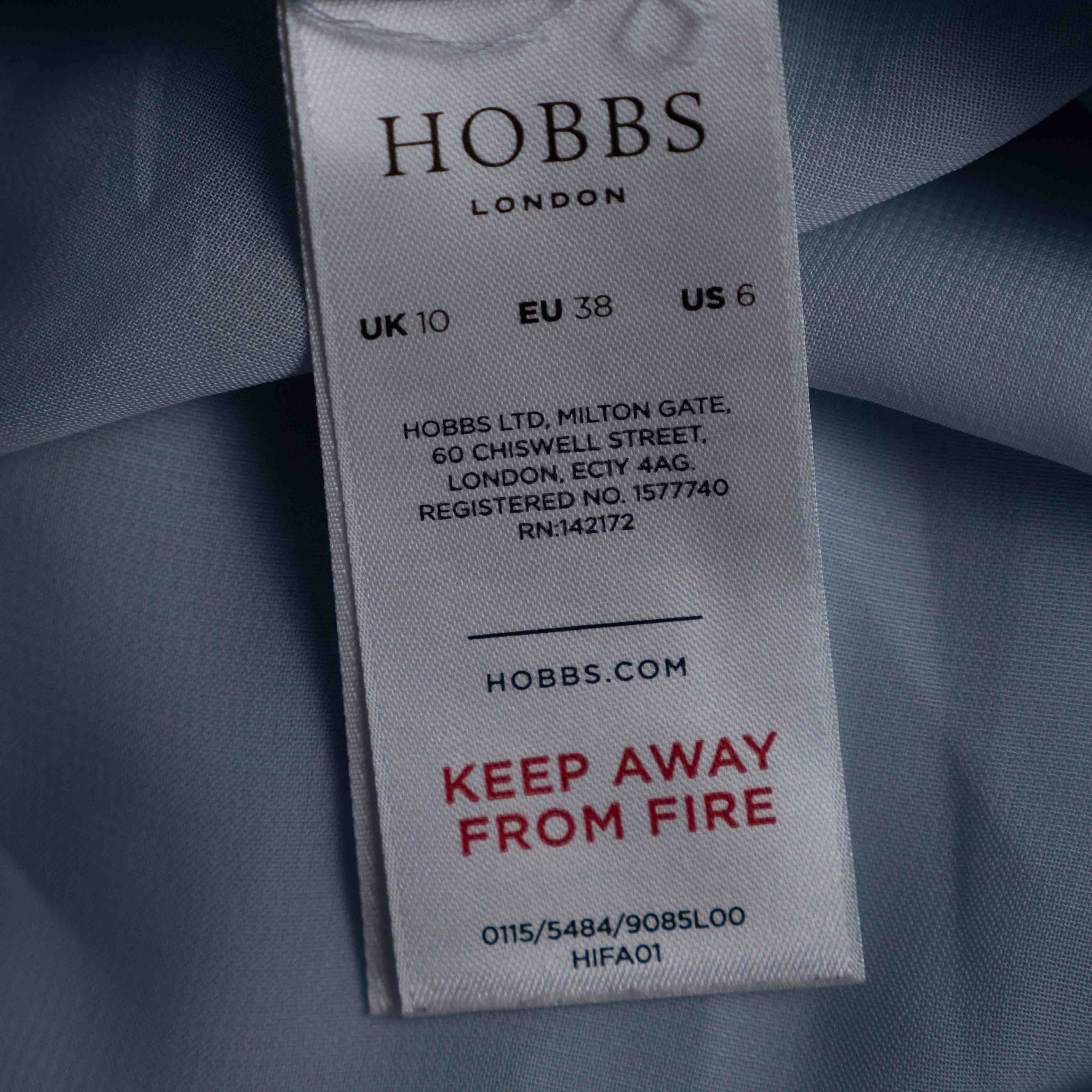 Hobbs London blue multicolour polka dot dress with ruffle hem and fitted waist.