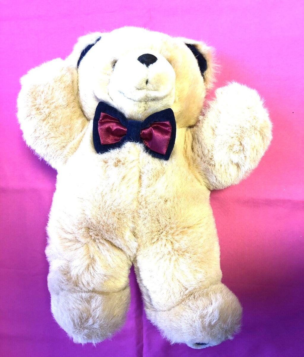 Kings Toys beige teddy bear with blue and red dickie bow, plush material.
