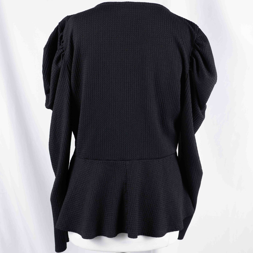 Dorothy Perkins black blouse with peplum hem and textured puff sleeves.