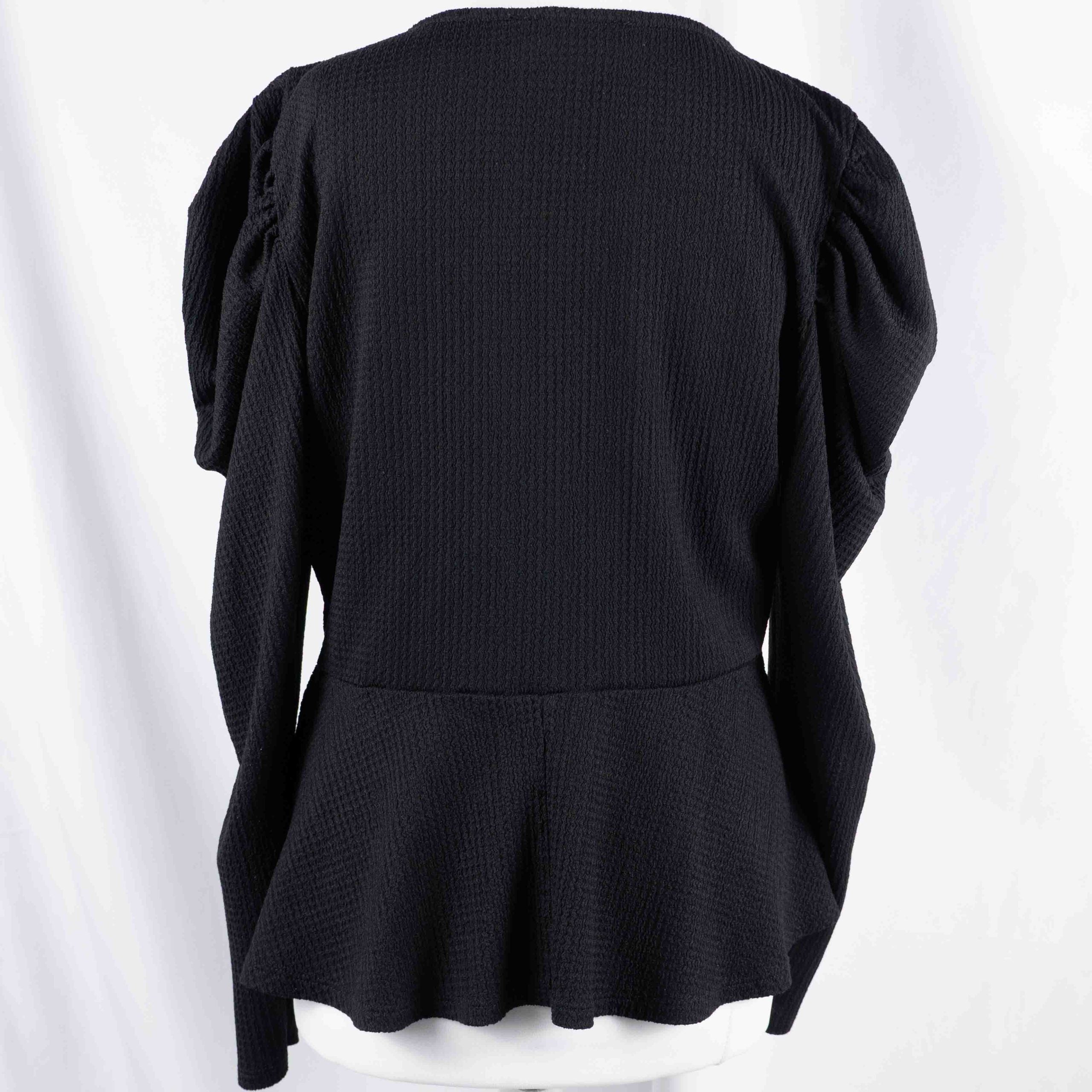Dorothy Perkins black blouse with peplum hem and textured puff sleeves.
