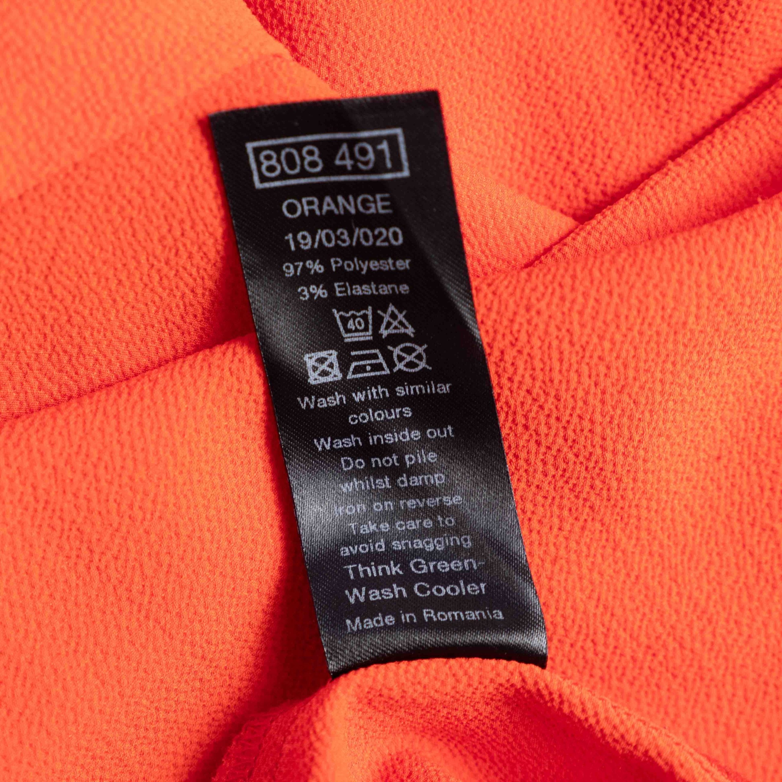 M&Co red layered blouse with short sleeves, made of polyester and elastane.