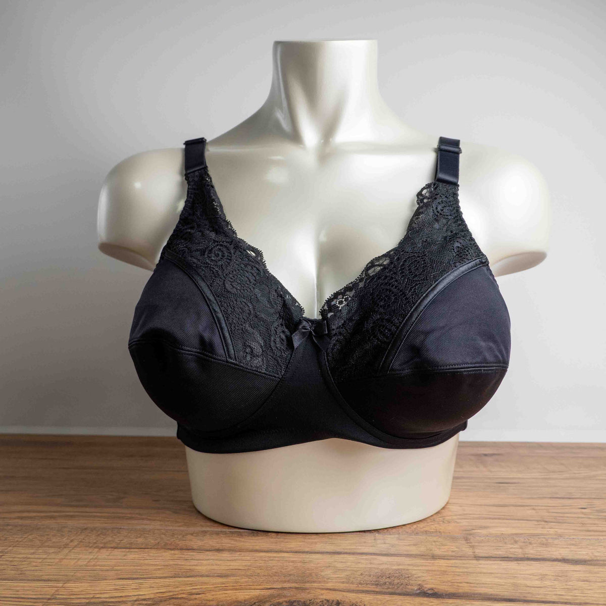 Anonymous black lace bra with soft cups and adjustable straps, brand new with tags.