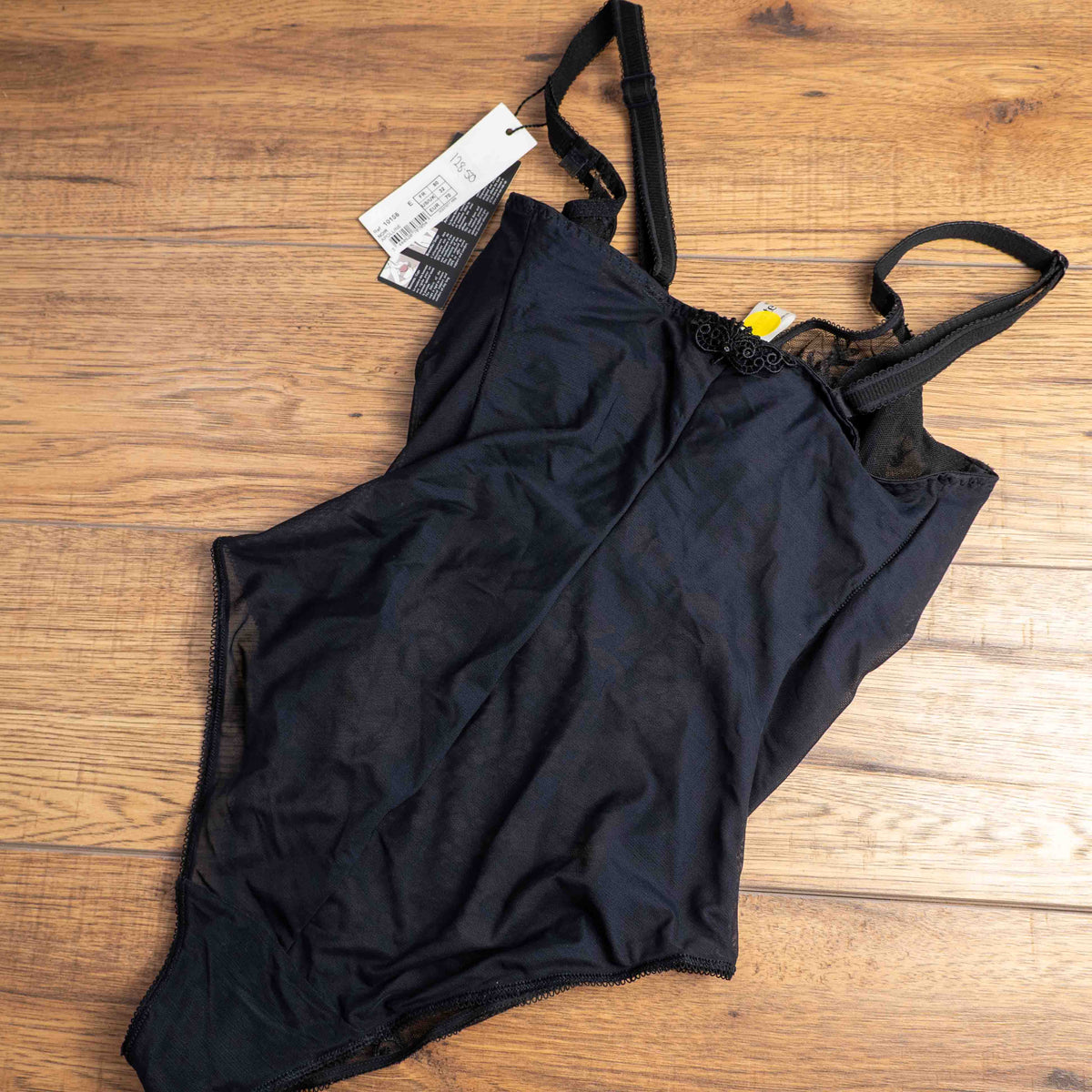 Empreinte black shapewear bodysuit with lace detailing, underwired cups, adjustable straps.