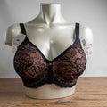 Triumph black lace bra with elegant overlay, underwired, adjustable straps, brand new with tags.