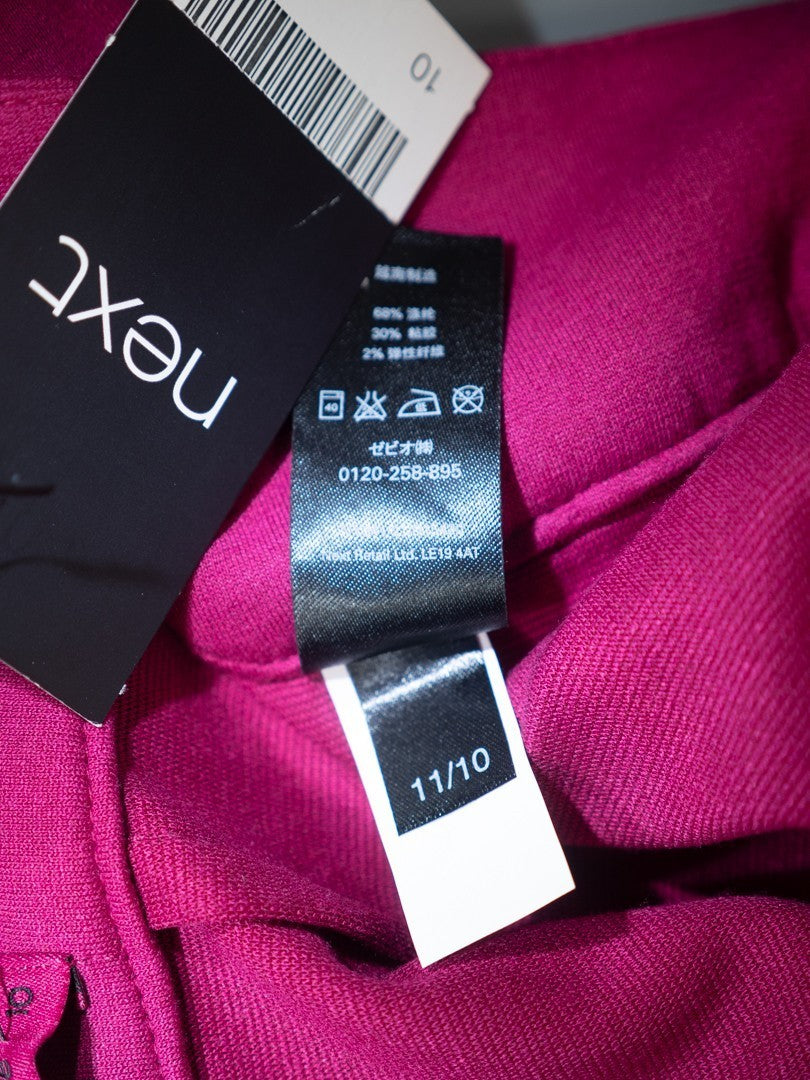 Next pink mini skirt with back zip closure and pleated front, new with tag.