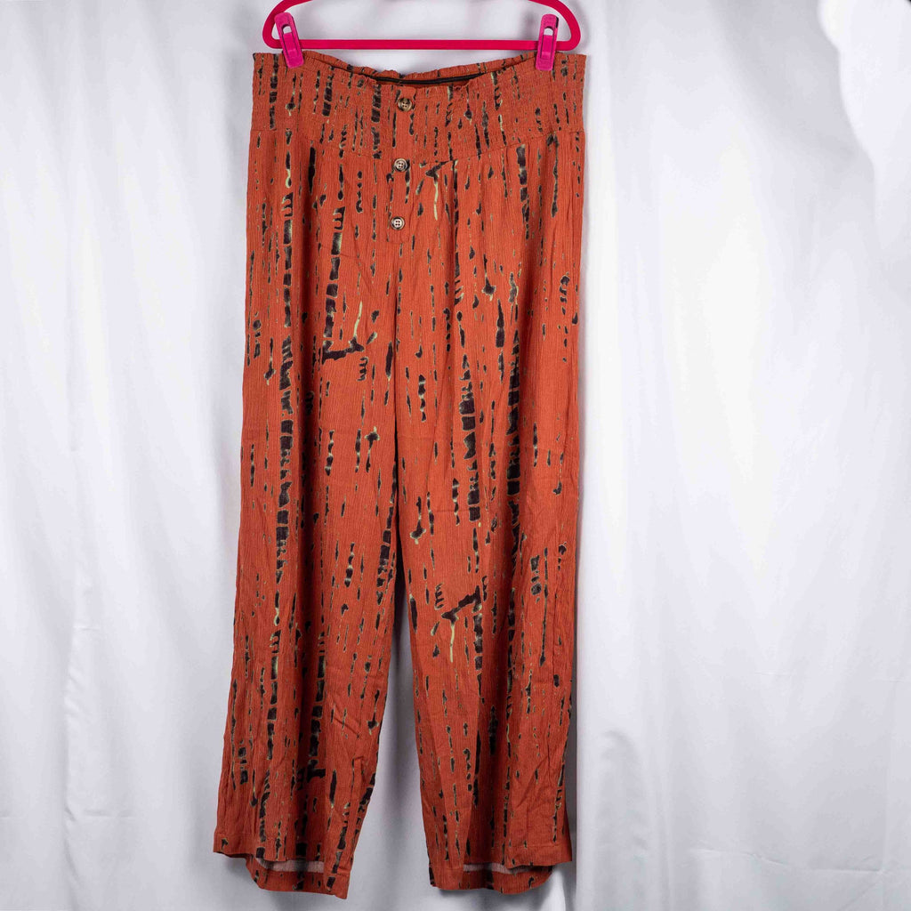 Bodyflirt orange wide-leg trousers with abstract black print and smocked waistband.