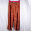 Bodyflirt orange wide-leg trousers with abstract black print and smocked waistband.