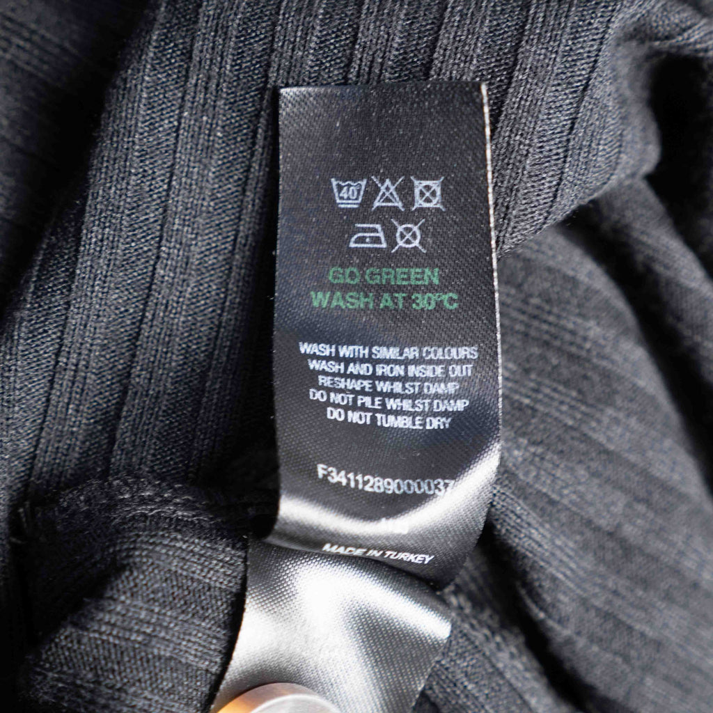 Unbranded black ribbed maxi dress with V neckline and three decorative front buttons.