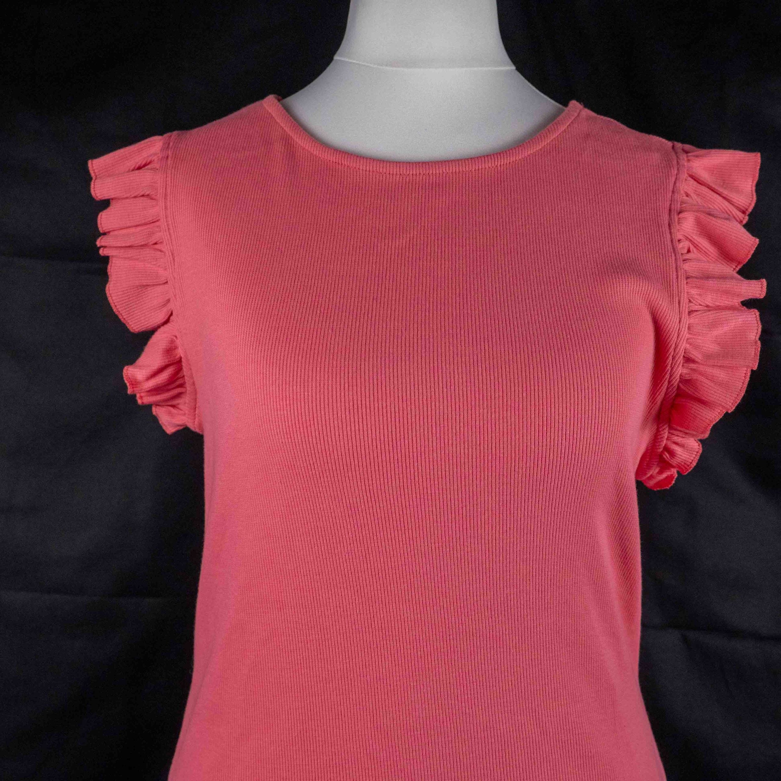 Papaya pink midi dress with ruffle sleeves and soft ribbed knit fabric.