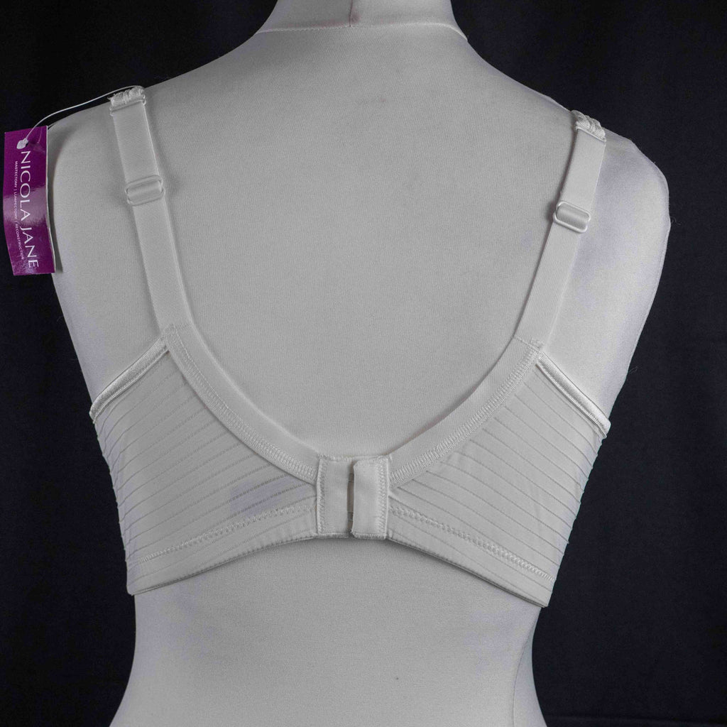Nicola Jane white mastectomy bra with adjustable straps and back hook closure.
