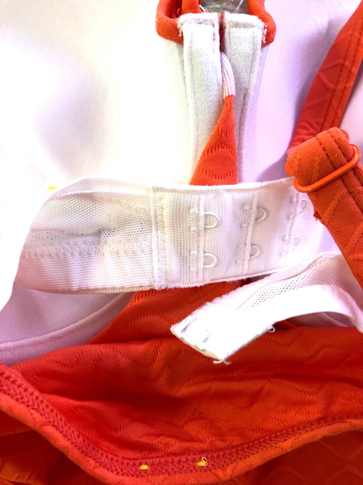 Panache orange tankini set with textured Aztec print and beaded bow detailing.