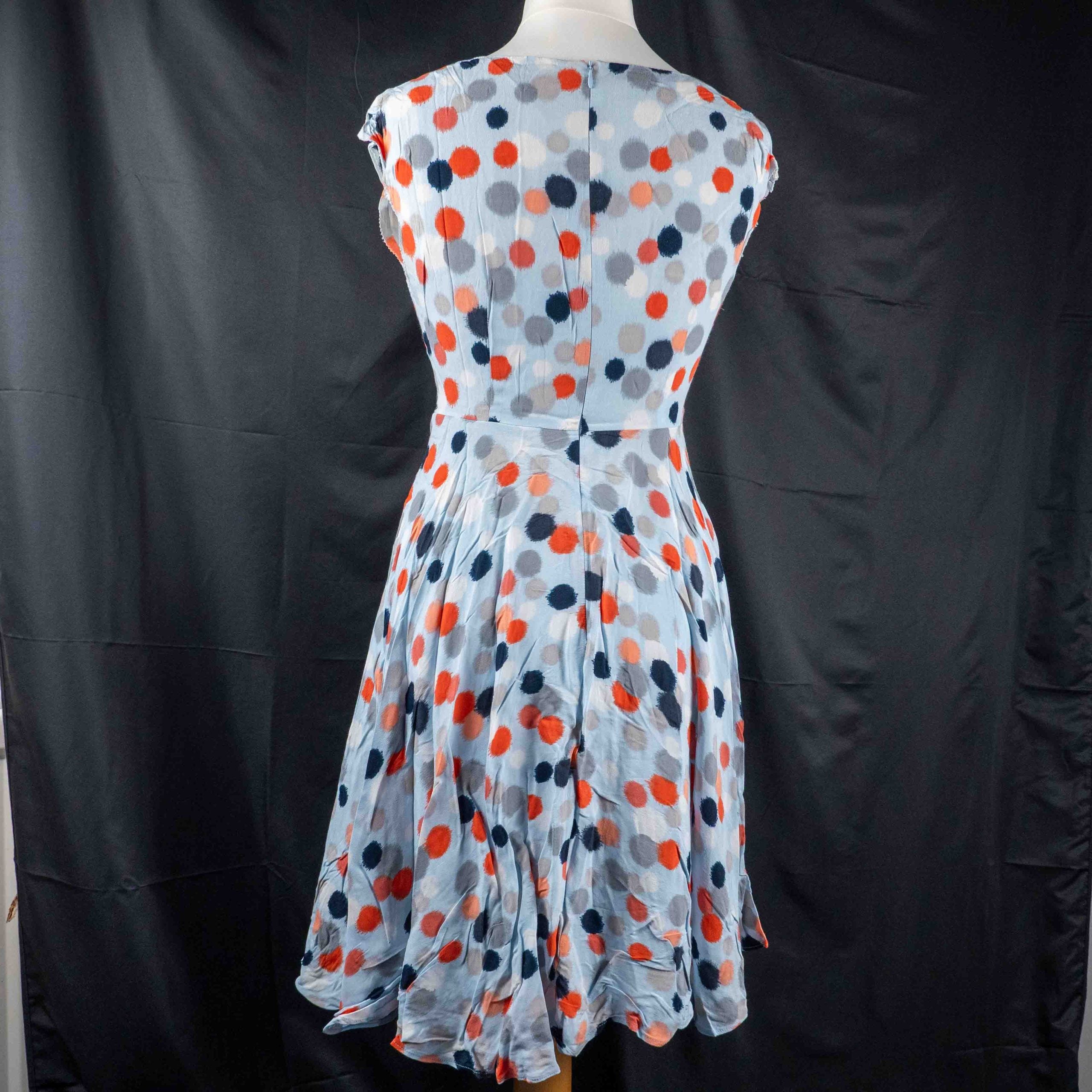 Hobbs London blue multicolour polka dot dress with ruffle hem and fitted waist.