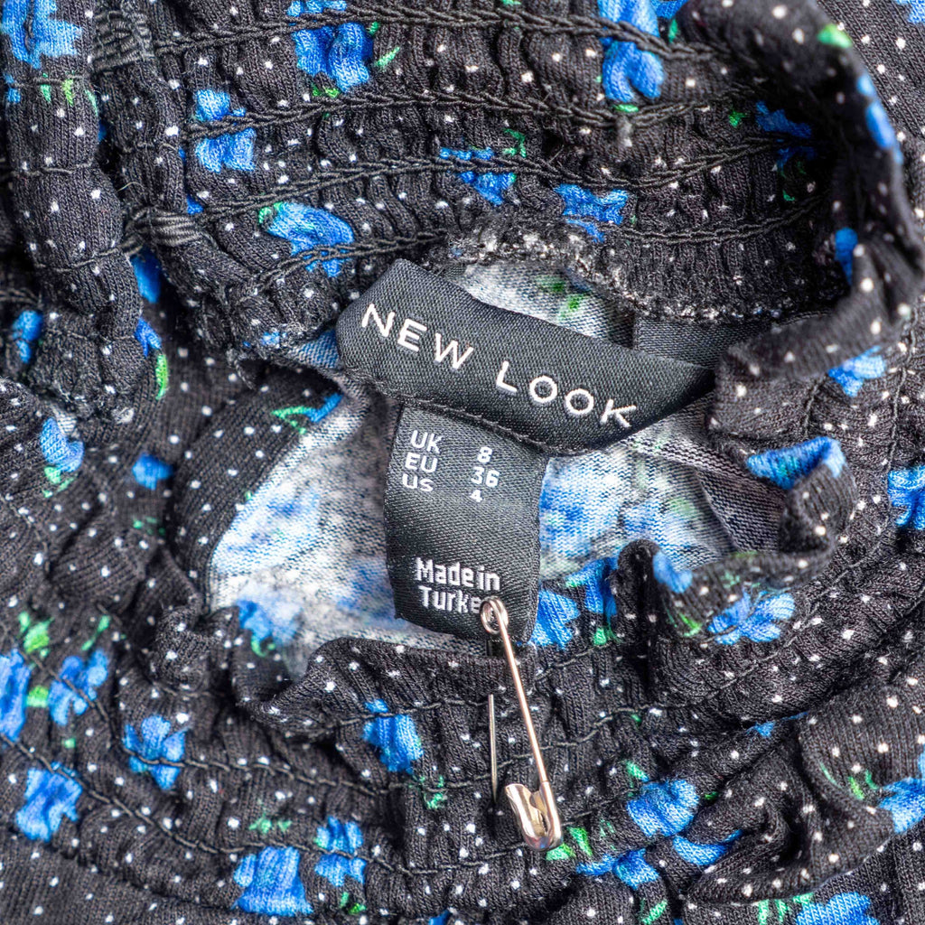 New Look black dress with blue floral print, ruffled high neckline, long sleeves.