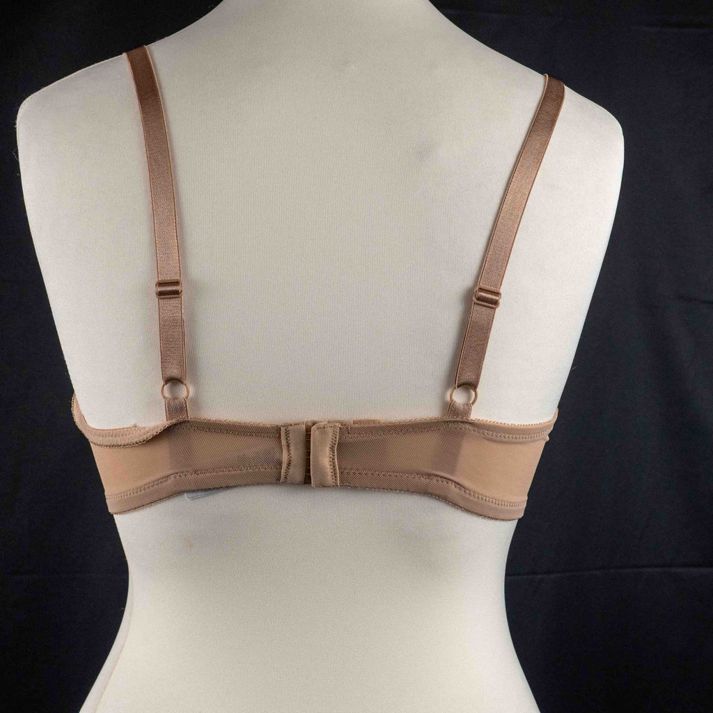 Wacoal beige and black underwired bras with floral lace design and adjustable straps.