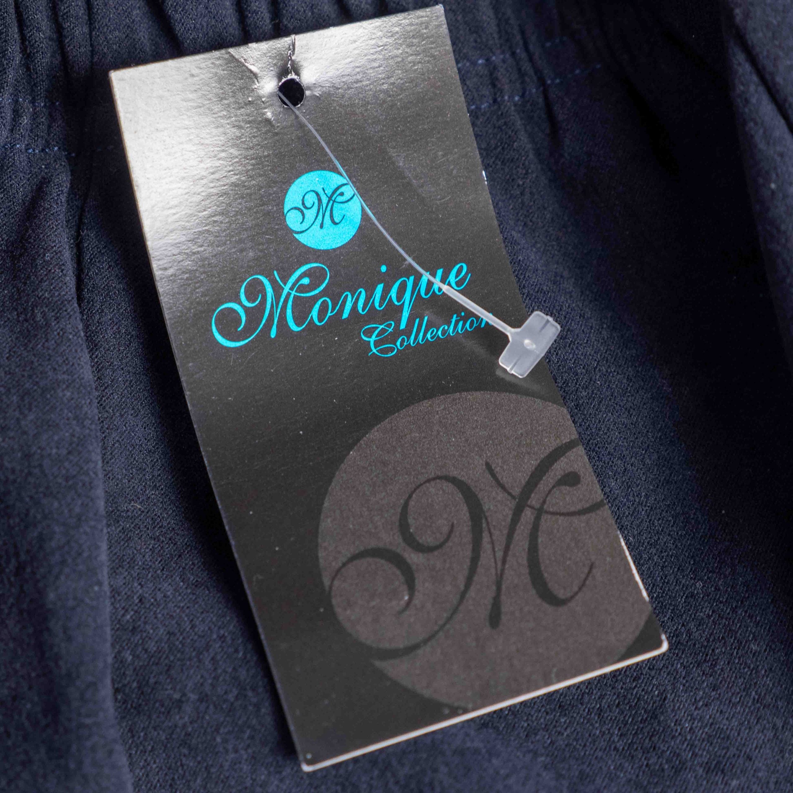 Monique navy velvet long skirt with elastic waistband and flared silhouette.
