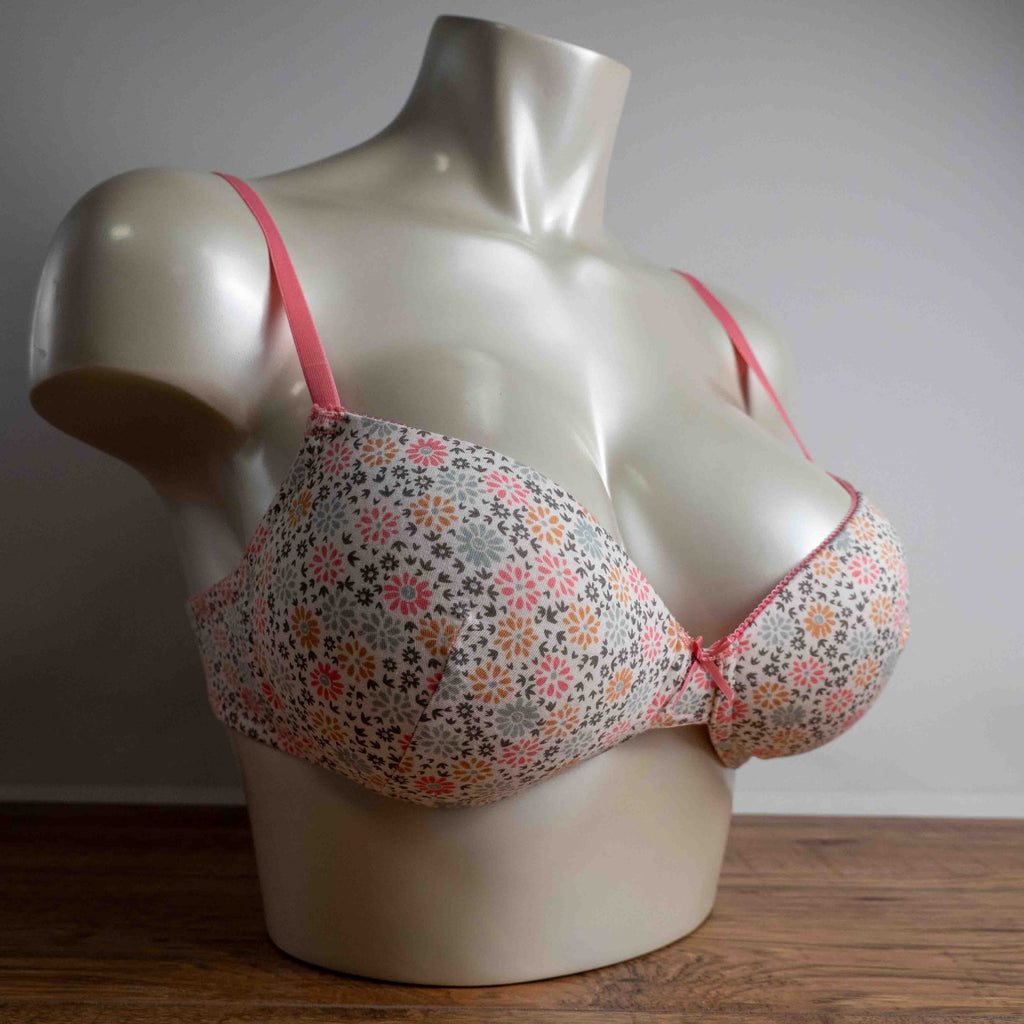 Royce white floral wire-free bra with pink straps and small pink bow detail.