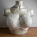 Fantasie white underwire bra with embroidered lace cups and adjustable straps.