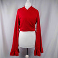 Boohoo red wrap crop top with floral print, ruffle cuffs, and tie-back design.