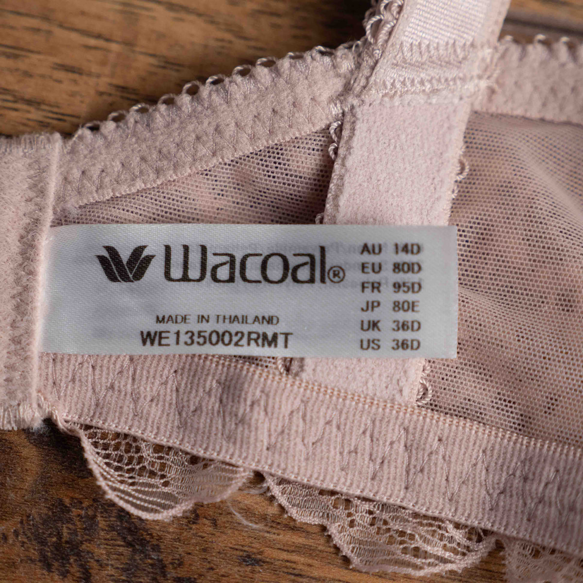 Wacoal dusty pink underwired bra with delicate lace detailing and adjustable straps.