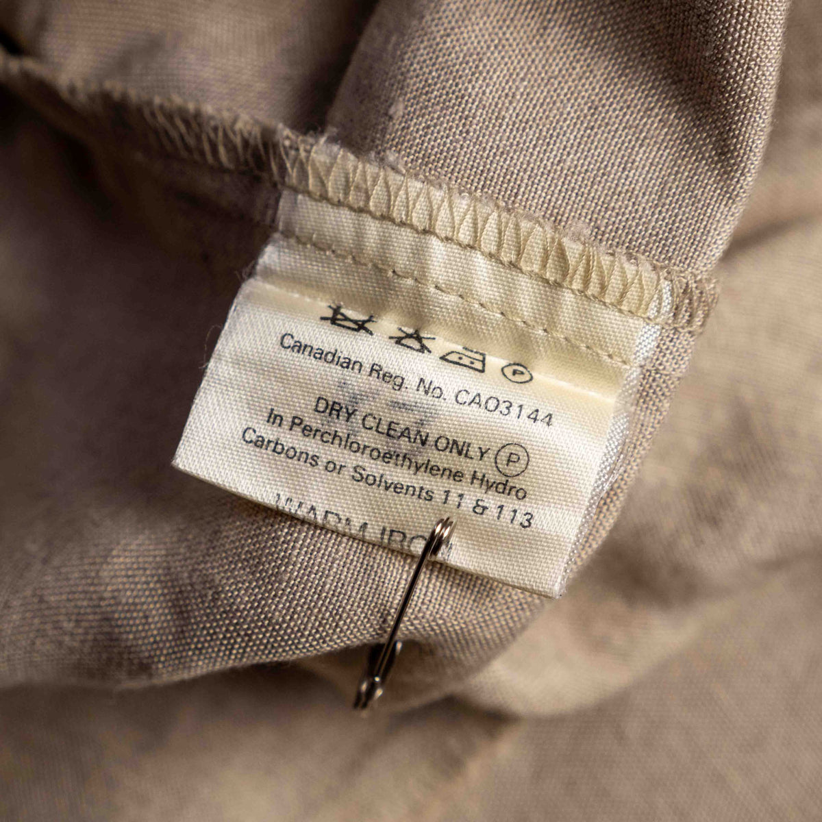 Jaeger beige linen tunic blouse with wooden buttons and back vent detail.
