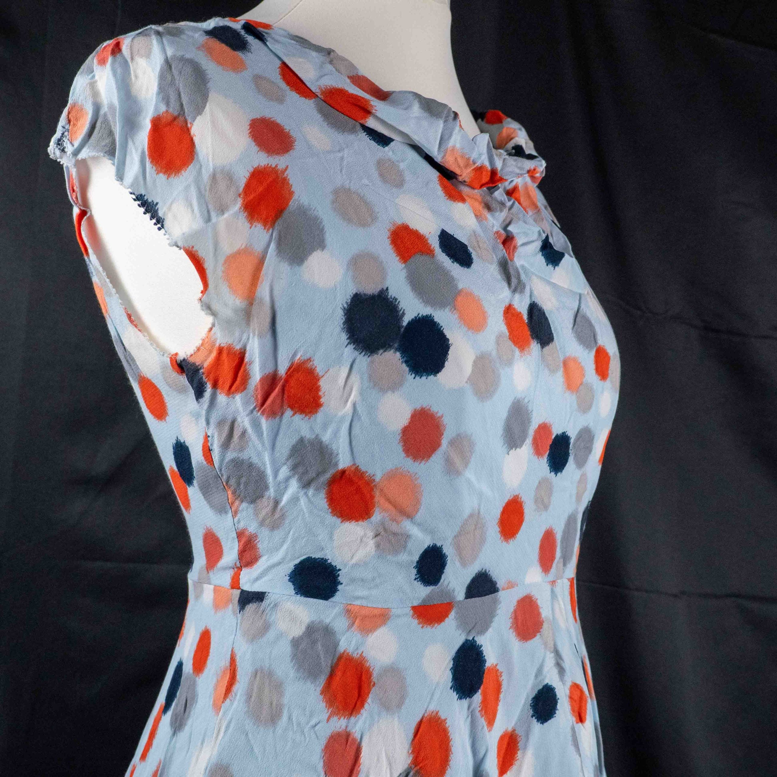 Hobbs London blue multicolour polka dot dress with ruffle hem and fitted waist.