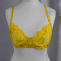 Bluebella yellow sheer lace bra with floral pattern and adjustable straps.