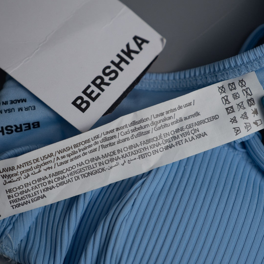 Bershka blue bikini top with line pattern, underwired, padded, and back buckle closure.