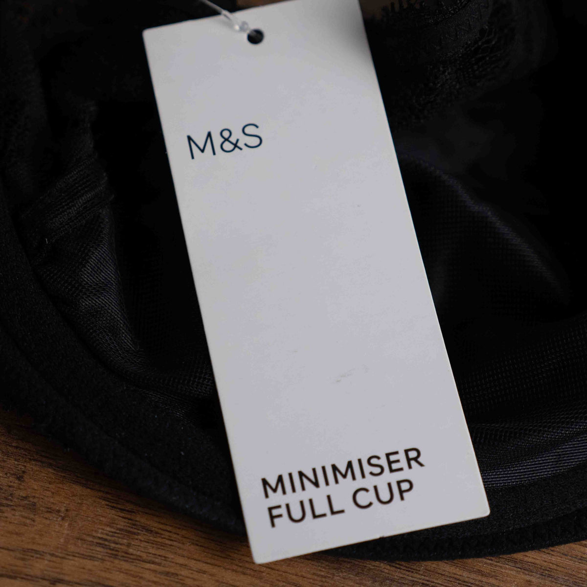M&S black lace underwired bra with floral lace upper cups and adjustable straps.